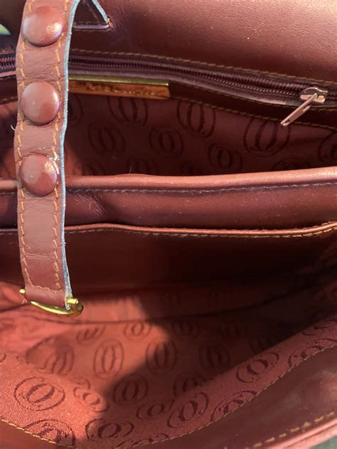 how to authenticate Cartier bag